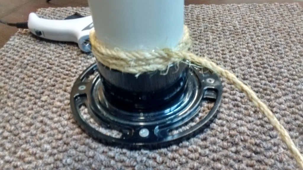Rope wrapped around a homemade cat scratching post base