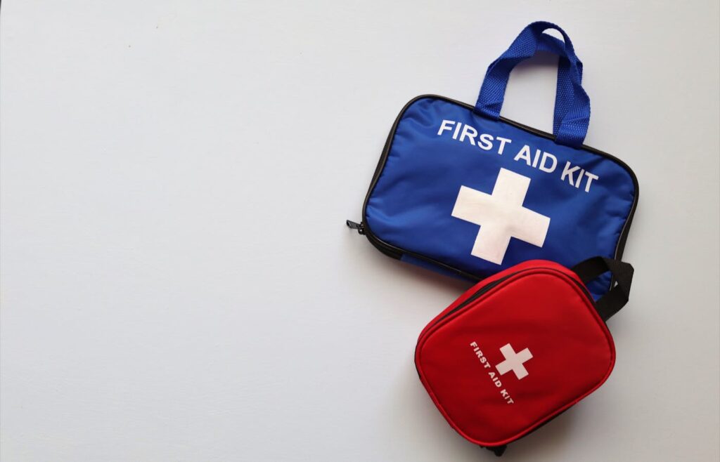 Emergency first aid kit bags on a white surface